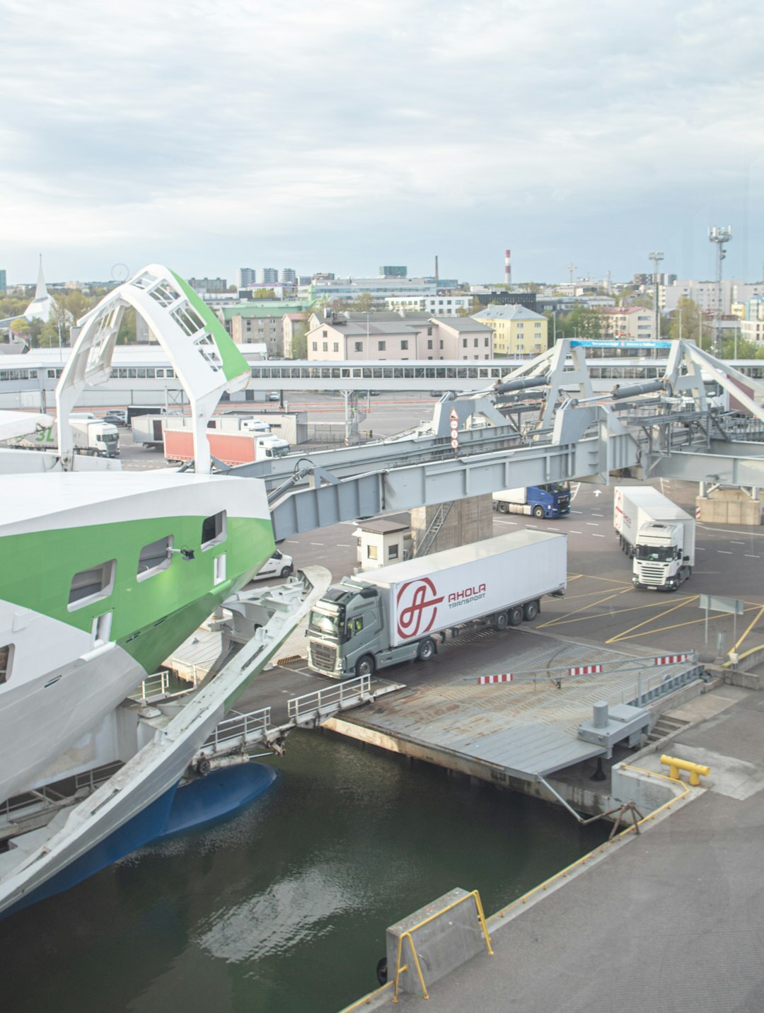 Cars being loaded onto a cargo ship at a port