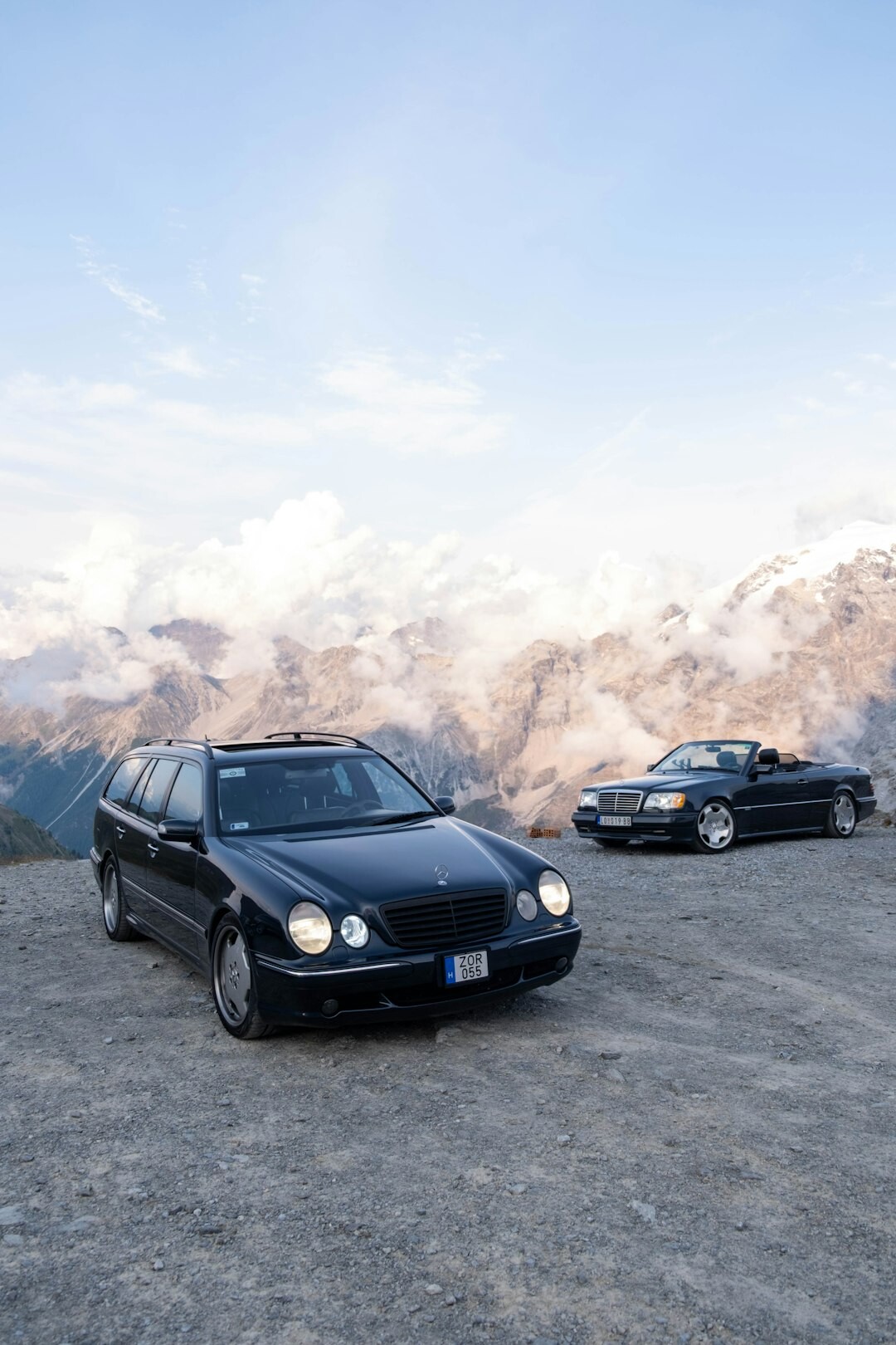 luxury car driving on mountain road