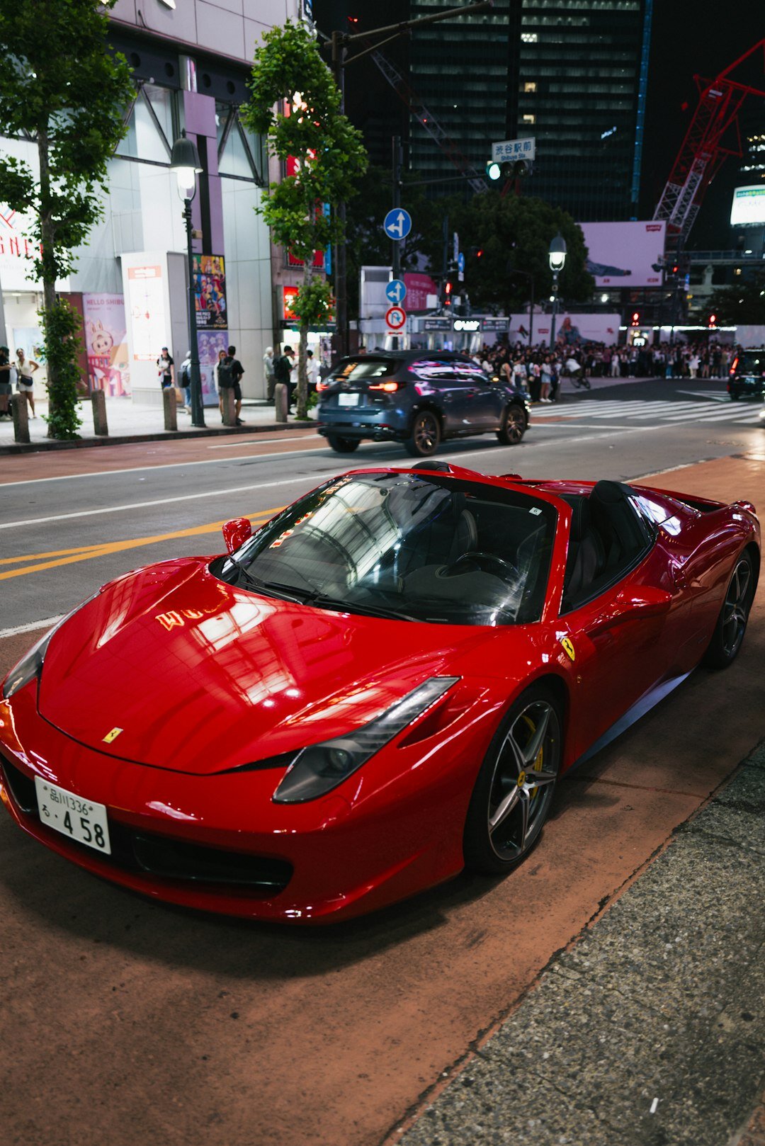 Japanese sports car on a night city street with neon lights