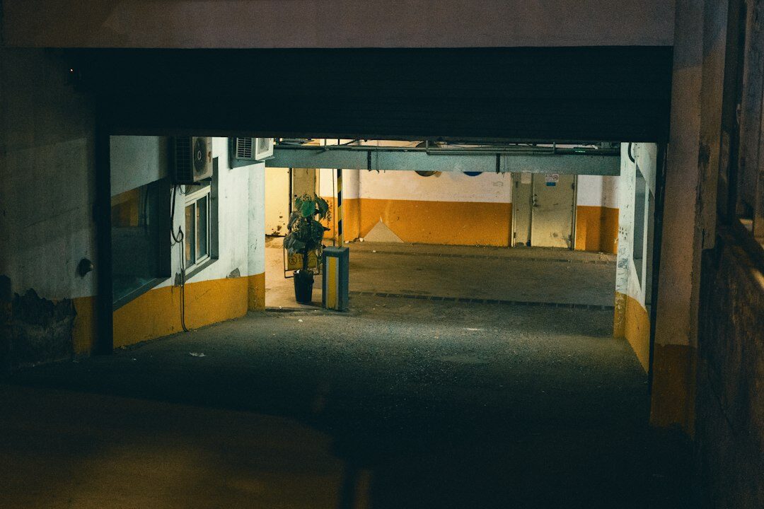 Yellow supercar parked in a dark underground garage