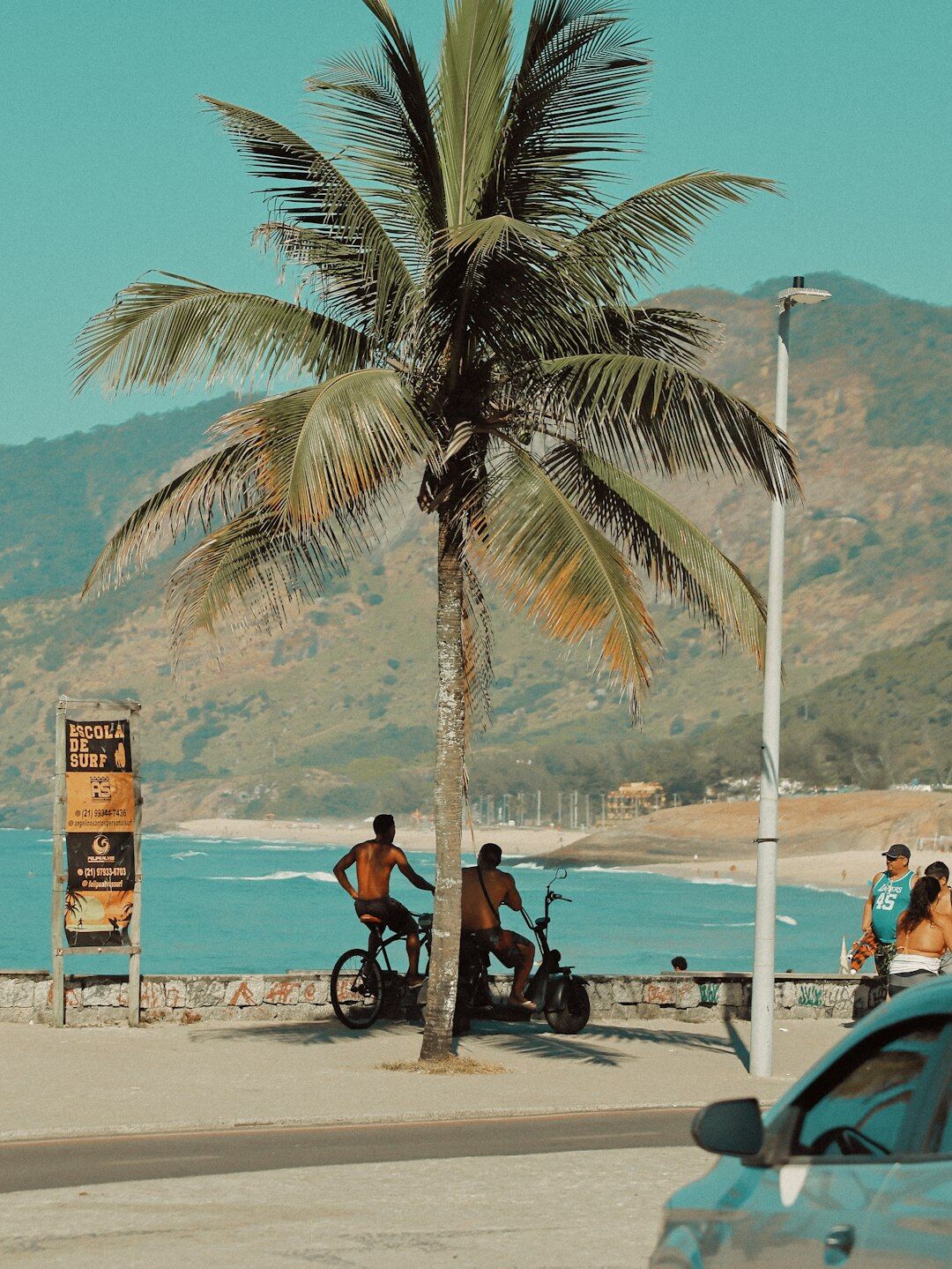 Compact car on a tropical Brazilian coastal avenue