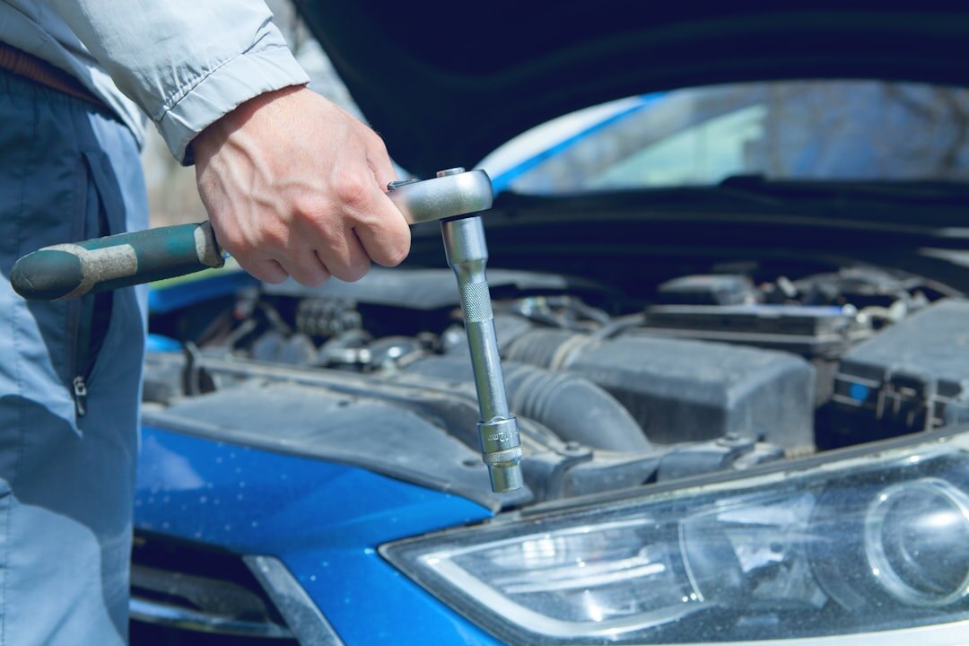 Mechanic inspecting a premium car engine bay